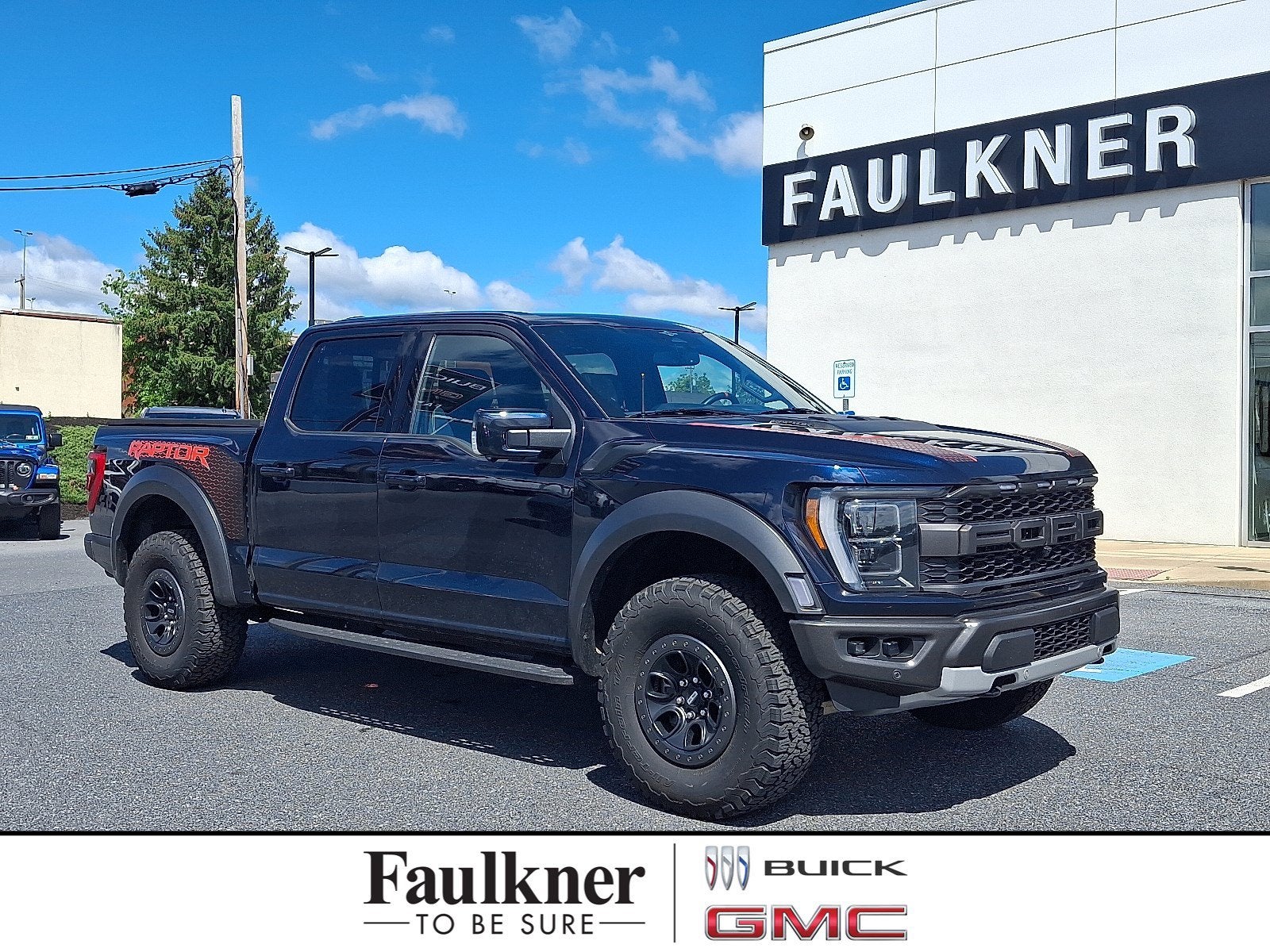 2023 Ford F-150 Raptor in Antimatter Blue Metallic — front three-quarter view