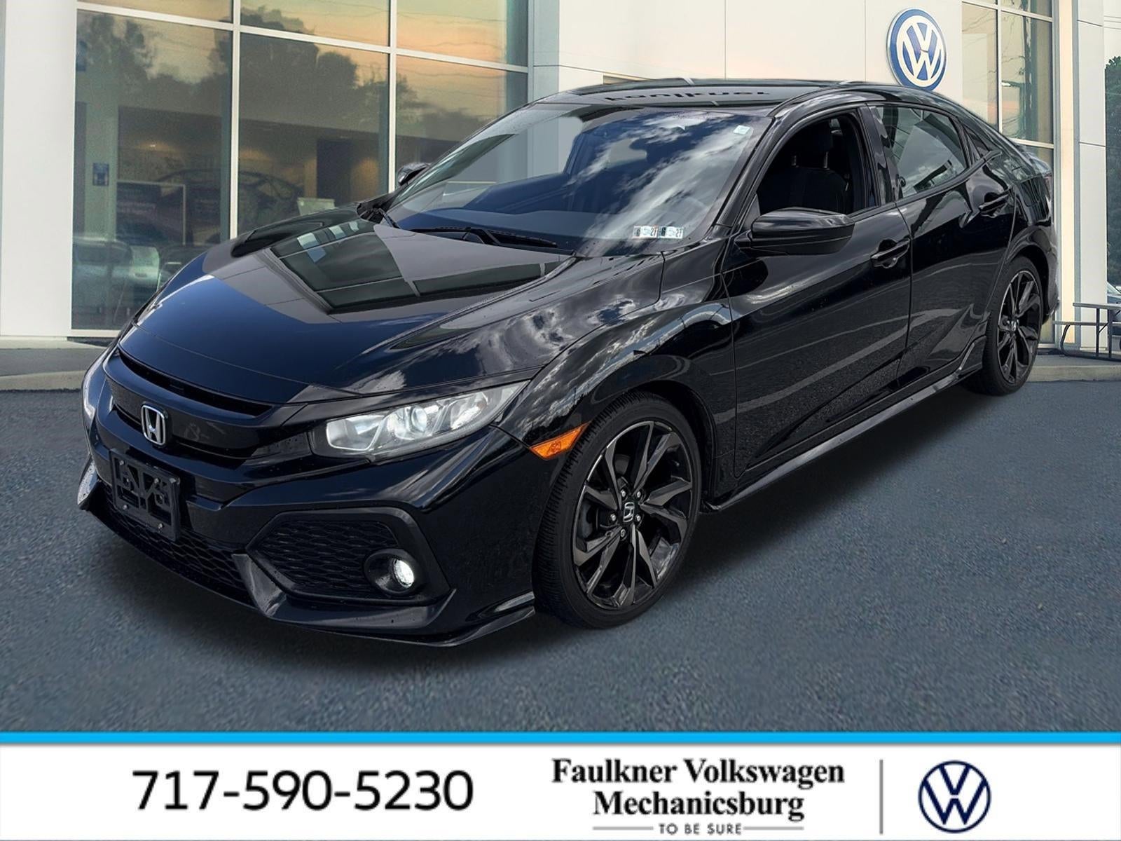 2017 Honda Civic Hatchback Sport CVT in Crystal Black Pearl — front three-quarter view