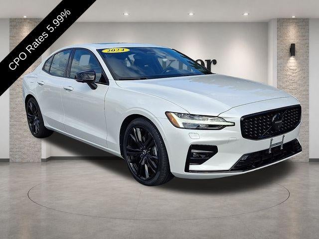2024 Volvo S60 B5 AWD Plus Black Edition in Crystal White Metallic — front three-quarter view