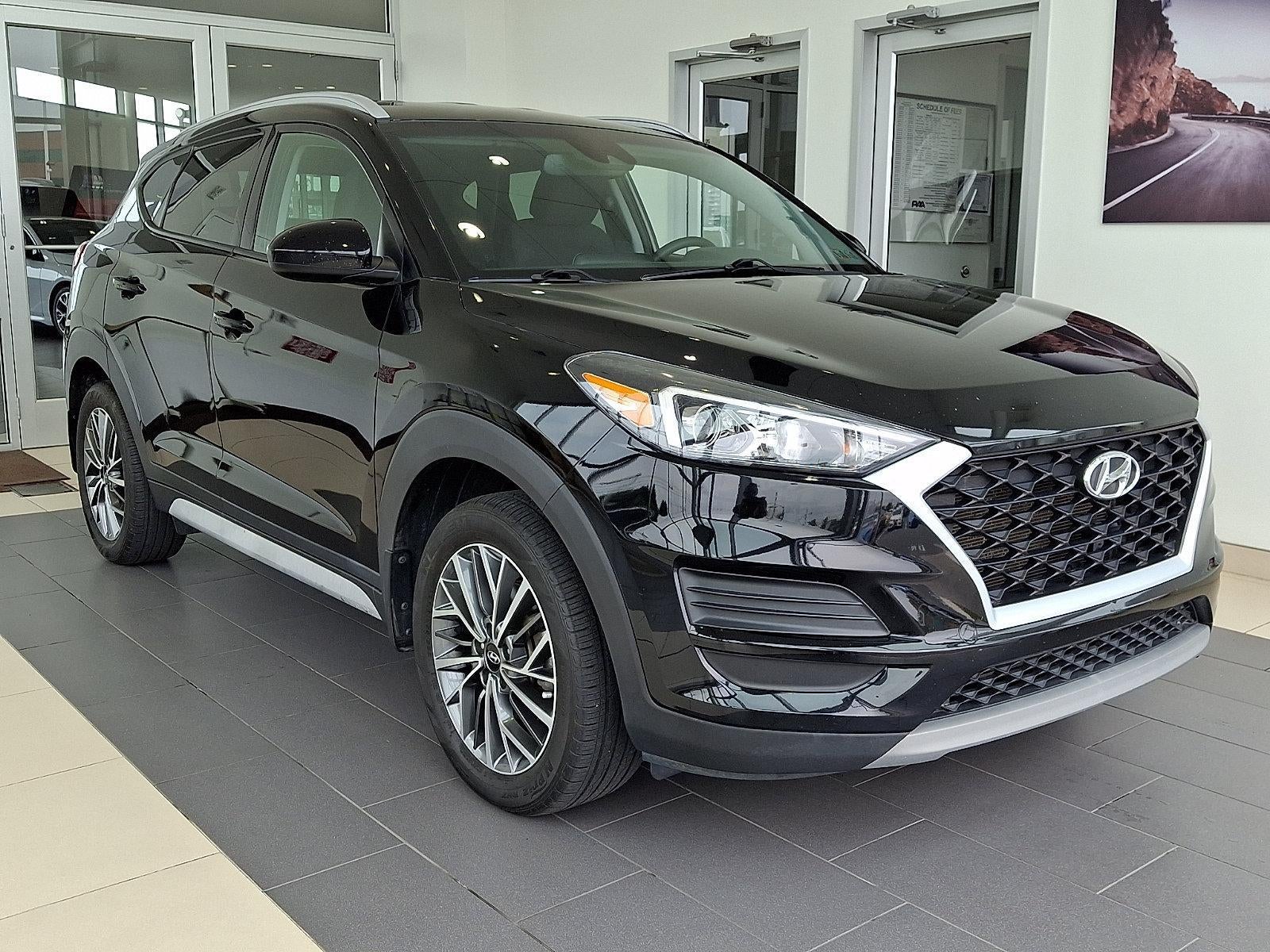 2020 Hyundai TUCSON SEL AWD in Black Noir Pearl — front three-quarter view