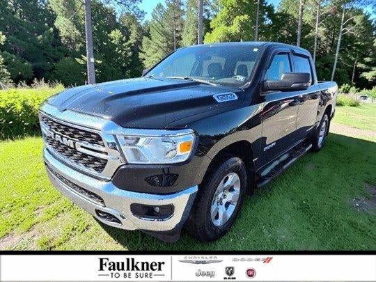 2023 RAM 1500 Big Horn 4x4 Crew Cab 5'7" Box in Diamond Black Crystal Pearlcoat — front three-quarter view
